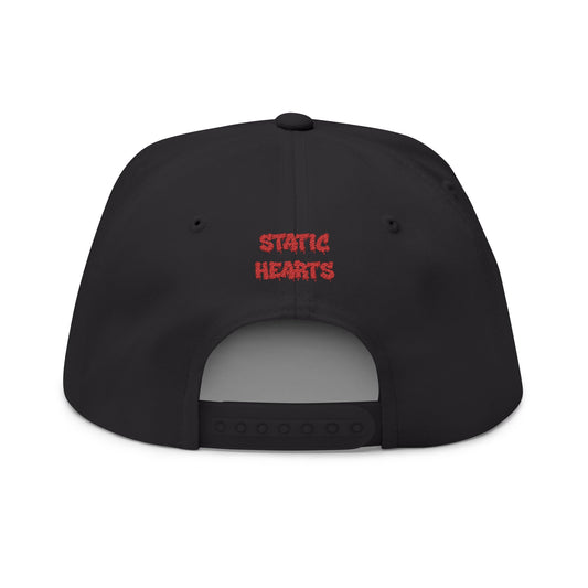 Static Hearts Skull Snapback alternative graphic t-shirt by Static Hearts inspired by pop punk, emo and horror.