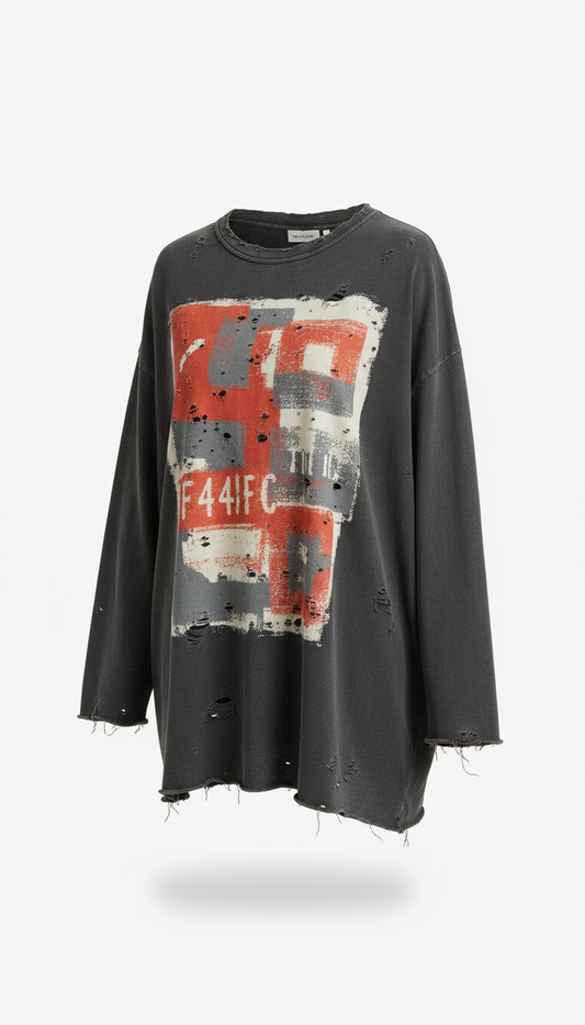 Oversized distressed graphic tee with raw edges